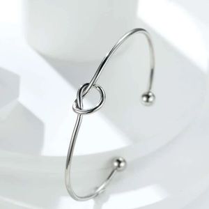 Knotted heart cuff bracelet